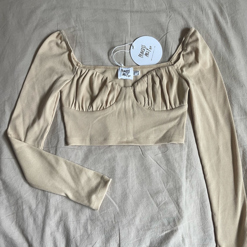Never worn Princess Polly boutique long sleeve crop top tags attached! Size 6